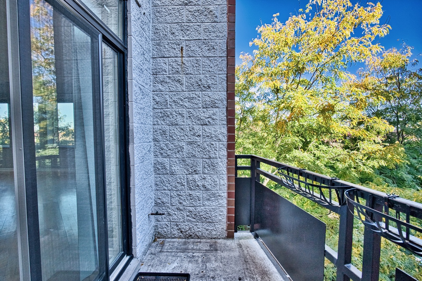 2317 West Wolfram Street, Unit 515 Chicago, IL 60618 - Photo 34 of 35 a view of a balcony with a tree