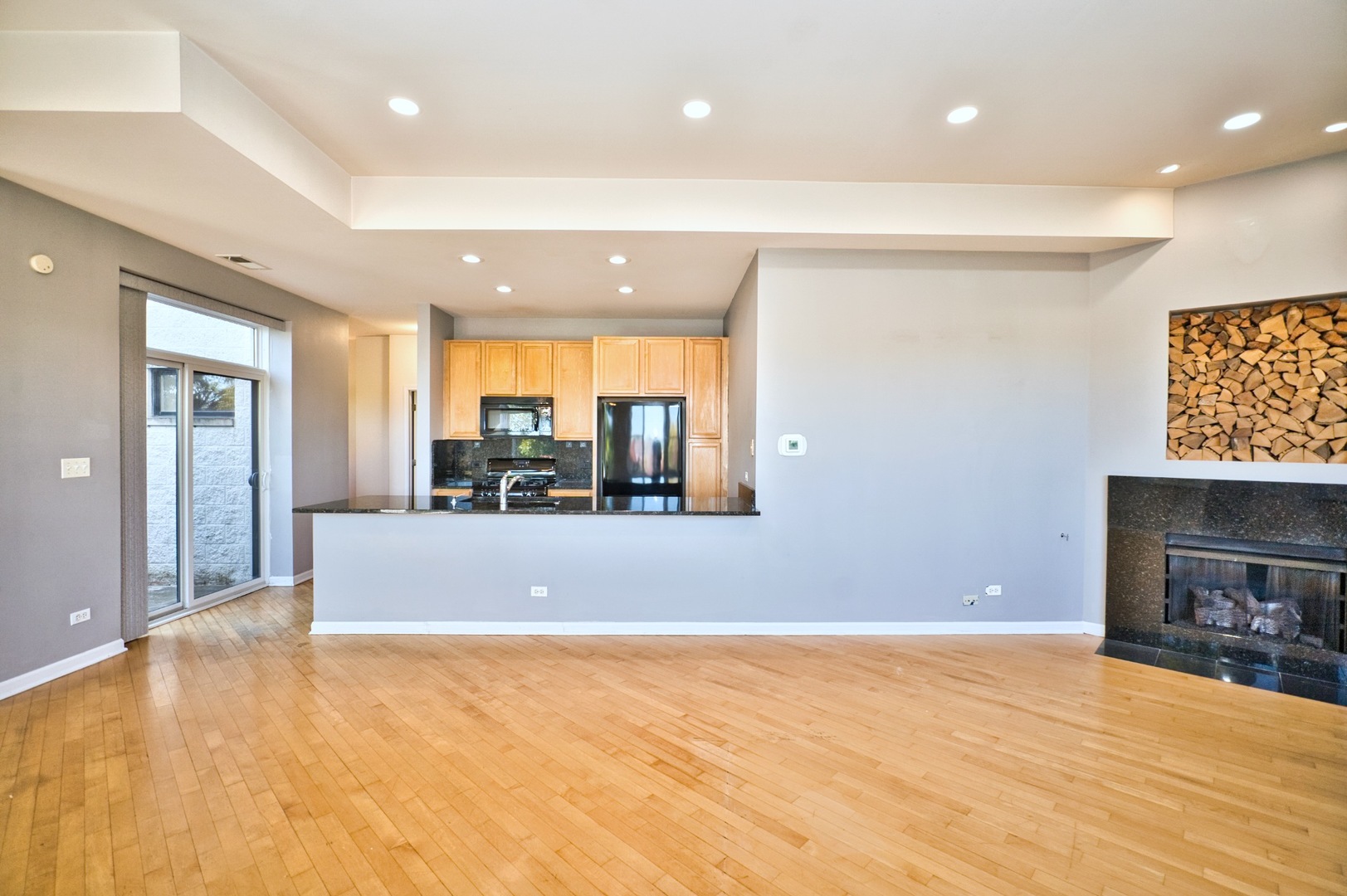 2317 West Wolfram Street, Unit 515 Chicago, IL 60618 - Photo 10 of 35 a view of a livingroom with a fireplace