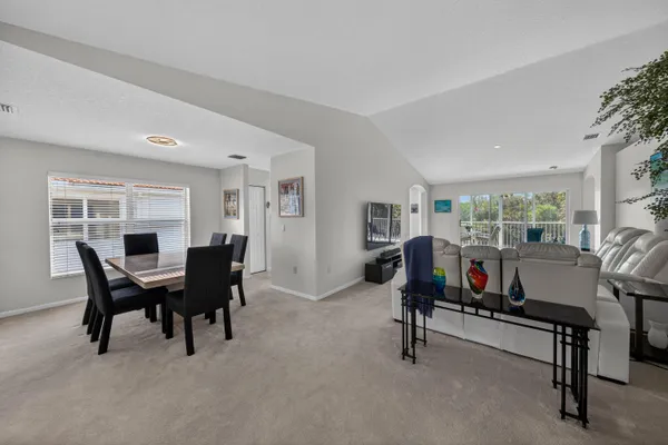 a view of a livingroom with furniture and a window