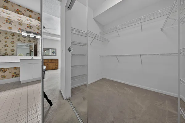 a view of a storage & utility room with racks on the wall