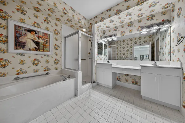 a bathroom with a bathtub sink and mirror