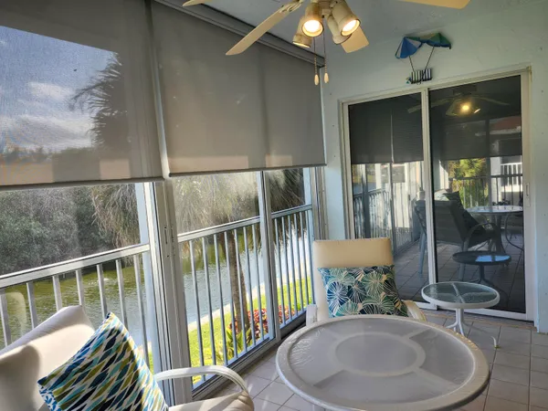 a view of a balcony and dining area