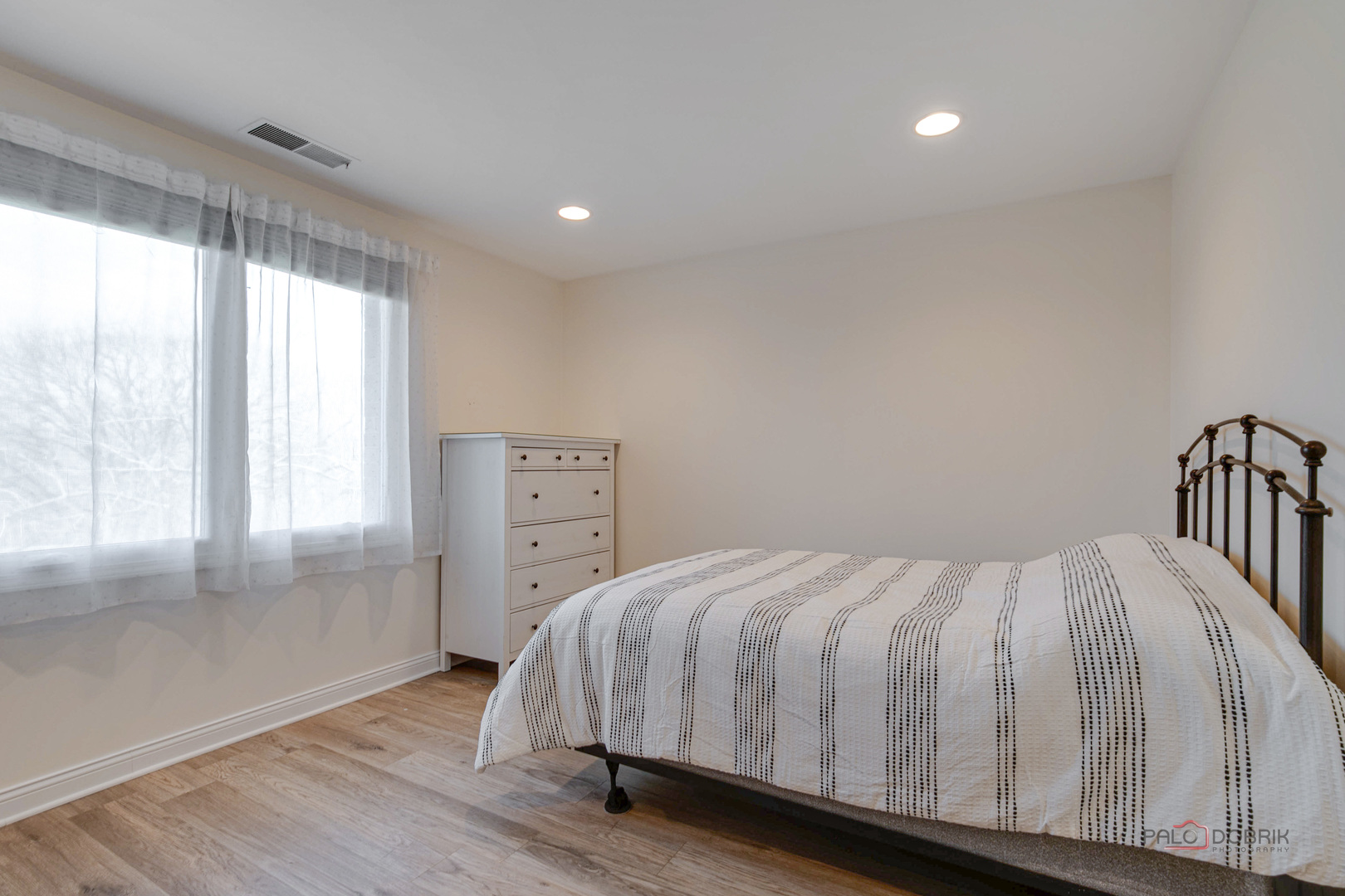 1795 Lake Cook Road, Unit 312 Highland Park, IL 60035 - Photo 16 of 26 a bedroom with a bed and a window