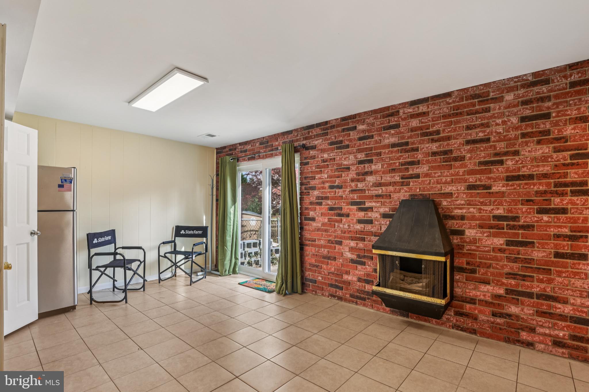 617 Denham Road Rockville, MD 20851 - Photo 17 of 31 Rec Room with rustic brick accents.