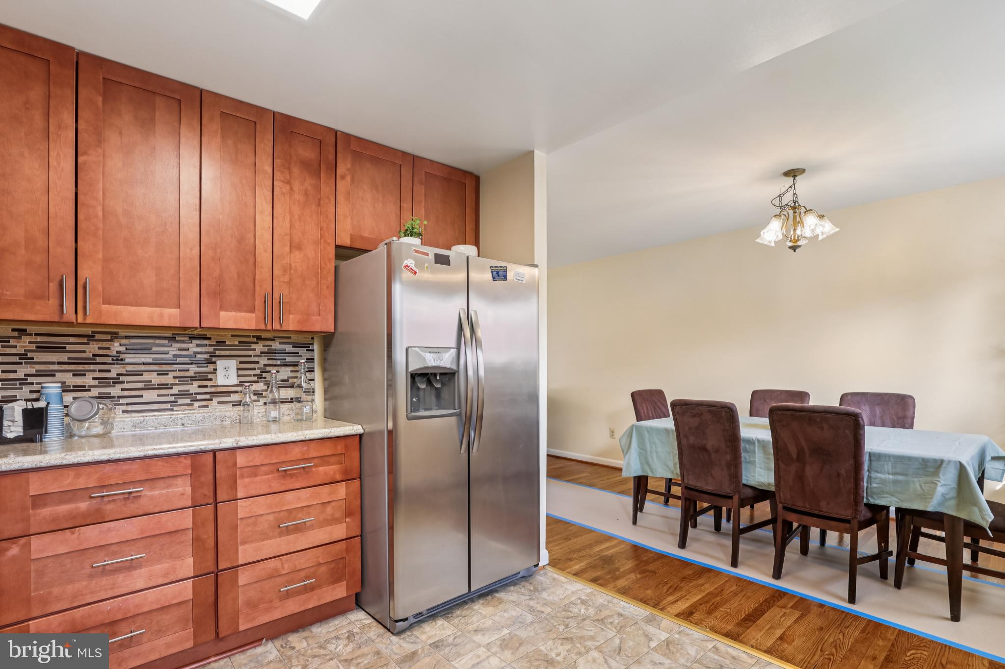 617 Denham Road Rockville, MD 20851 - Photo 8 of 31 Modern kitchen with warm wood accents.