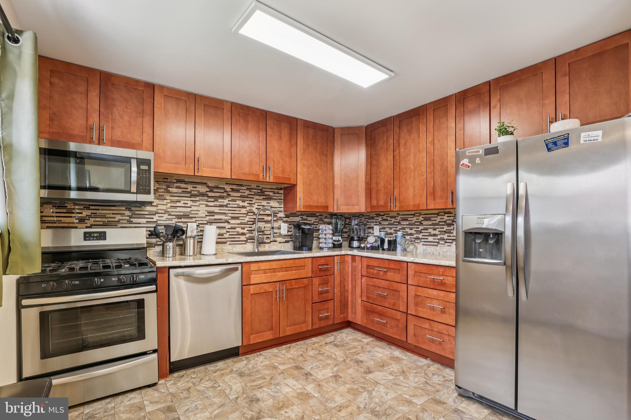 617 Denham Road Rockville, MD 20851 - Photo 9 of 31 Modern kitchen with sleek cabinetry and applian...