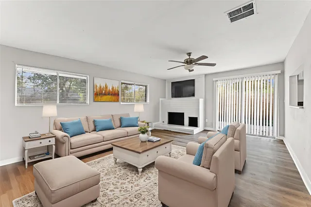 a living room with furniture and a fireplace