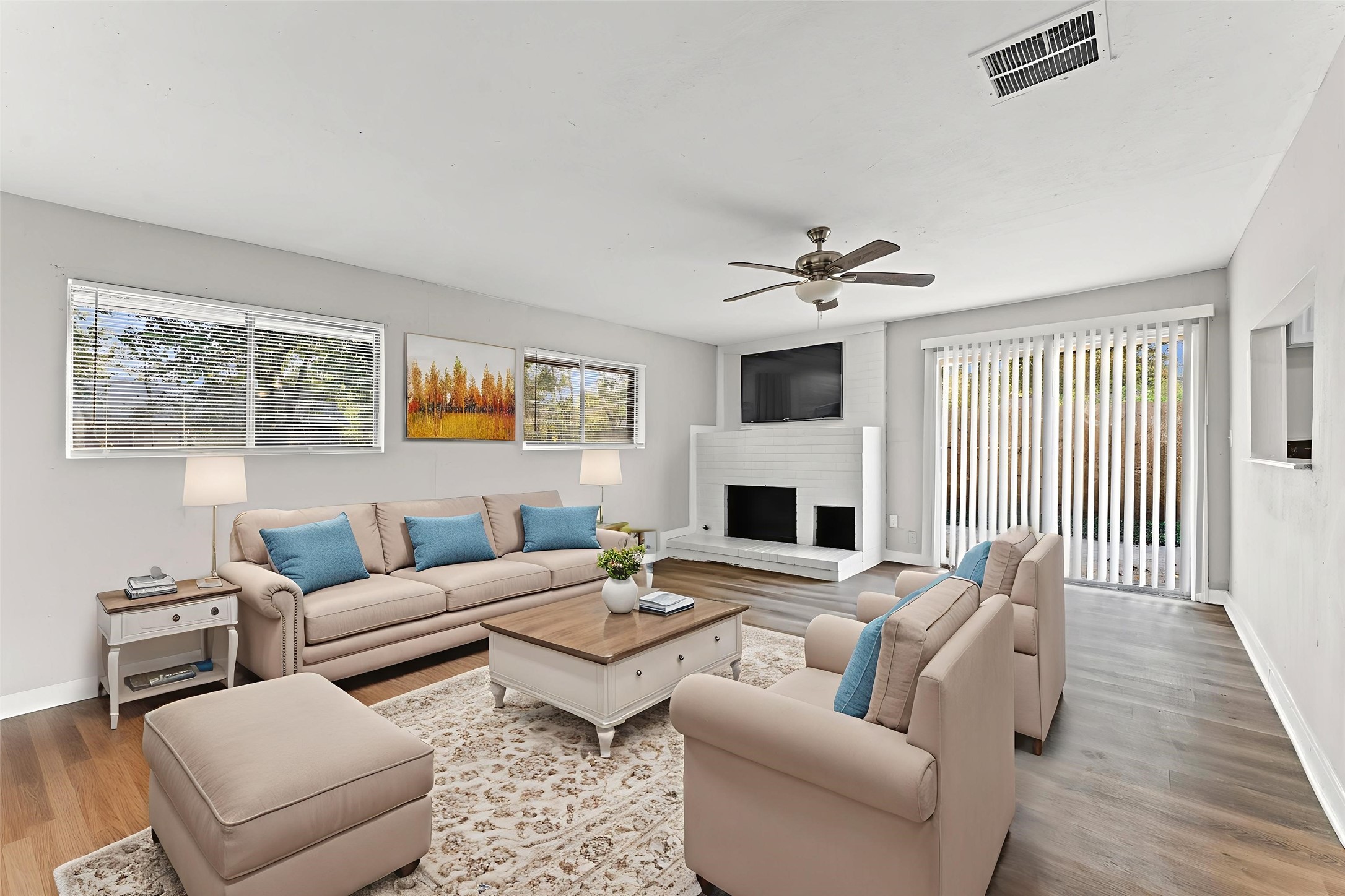 a living room with furniture and a fireplace