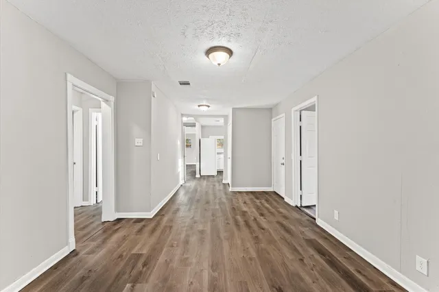a view of a livingroom with wooden floor