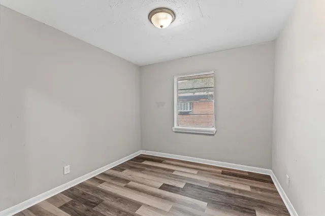 a view of a room with window and ceiling fan