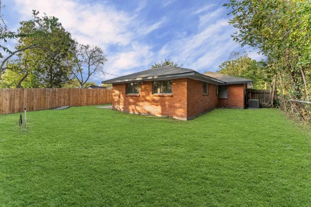 a view of a backyard with a small cabin