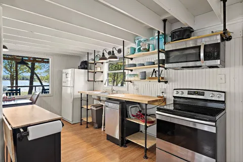 a kitchen with a stove and a microwave