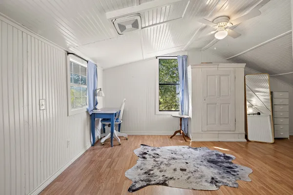 a bed room with a bed and a window