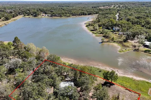 an aerial view of a houses with ocean view