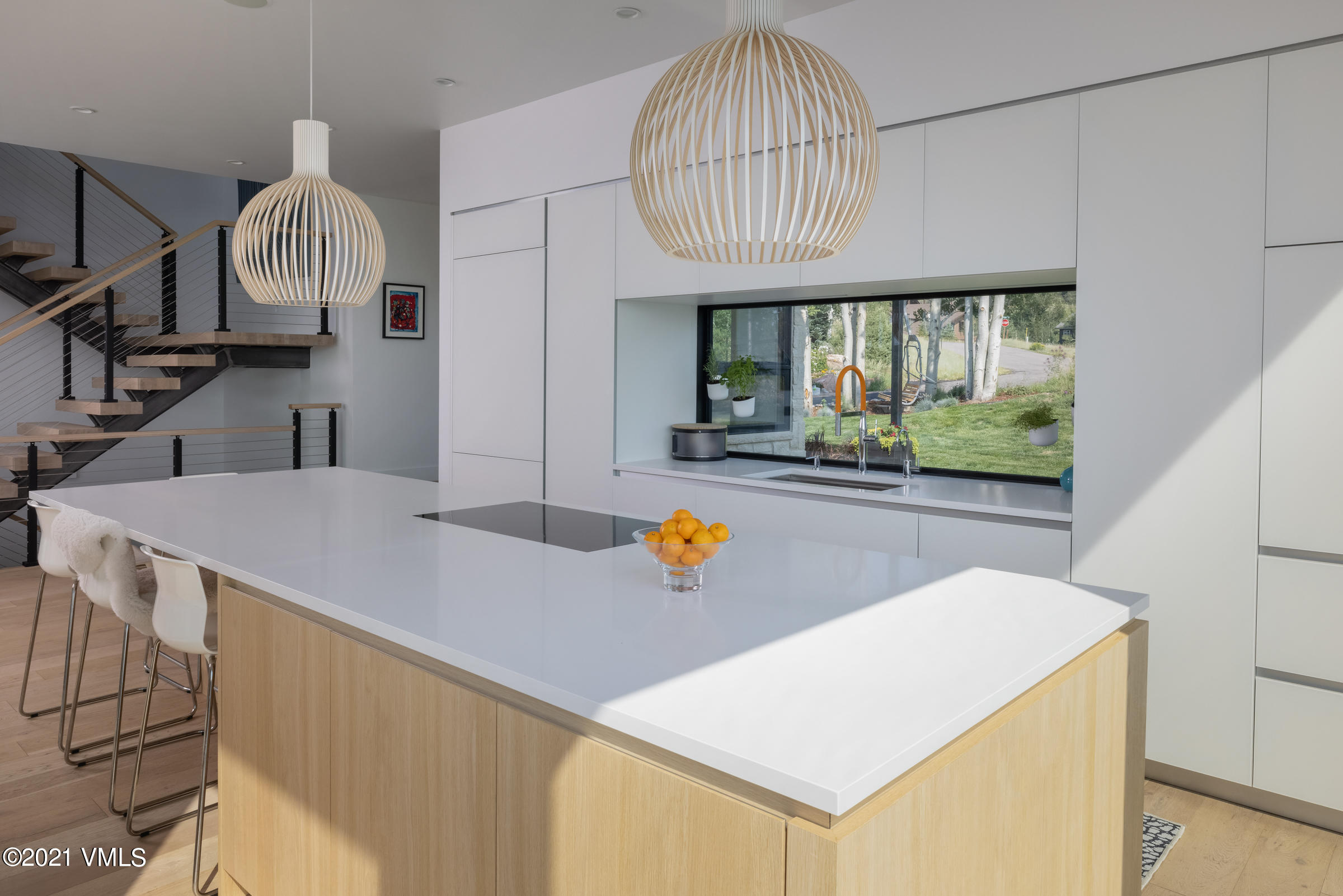 4380 June Point Avon, CO 81620 - Photo 14 of 39 a view of a kitchen from a dining room