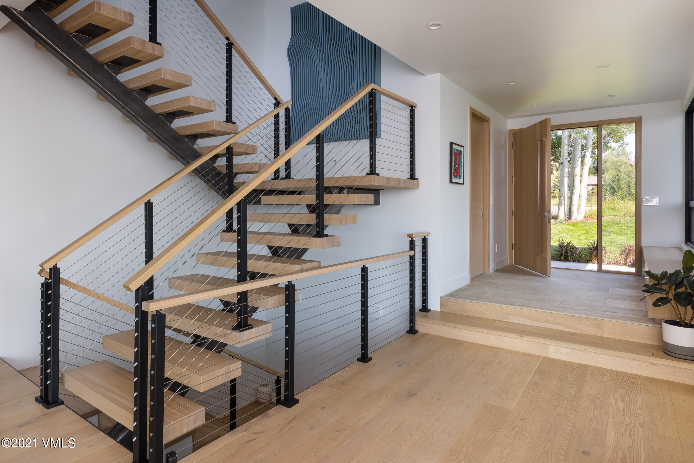 4380 June Point Avon, CO 81620 - Photo 16 of 39 a view of entryway and hall with wooden floor