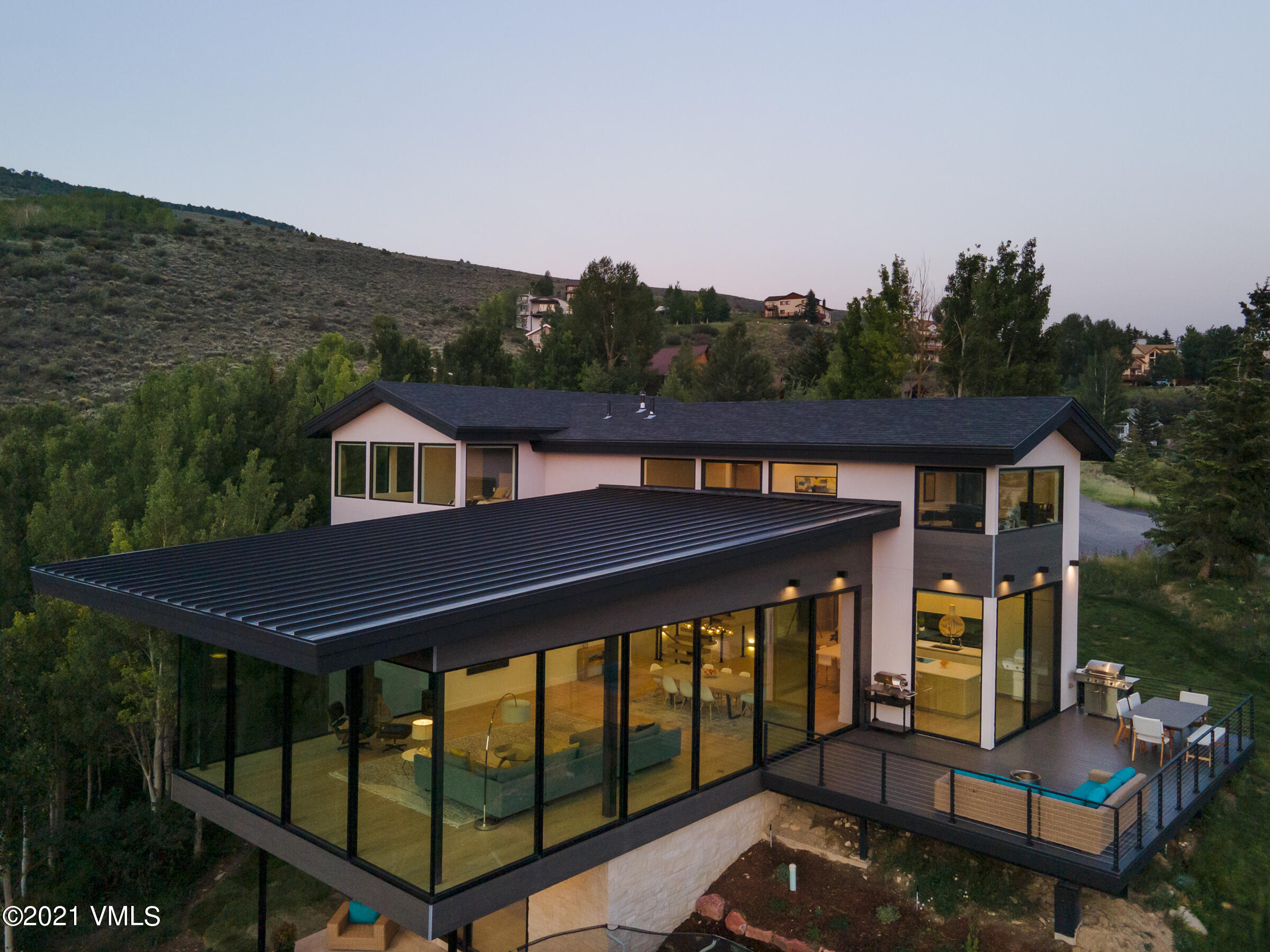 4380 June Point Avon, CO 81620 - Photo 2 of 39 a front view of house with yard animal statue and green space