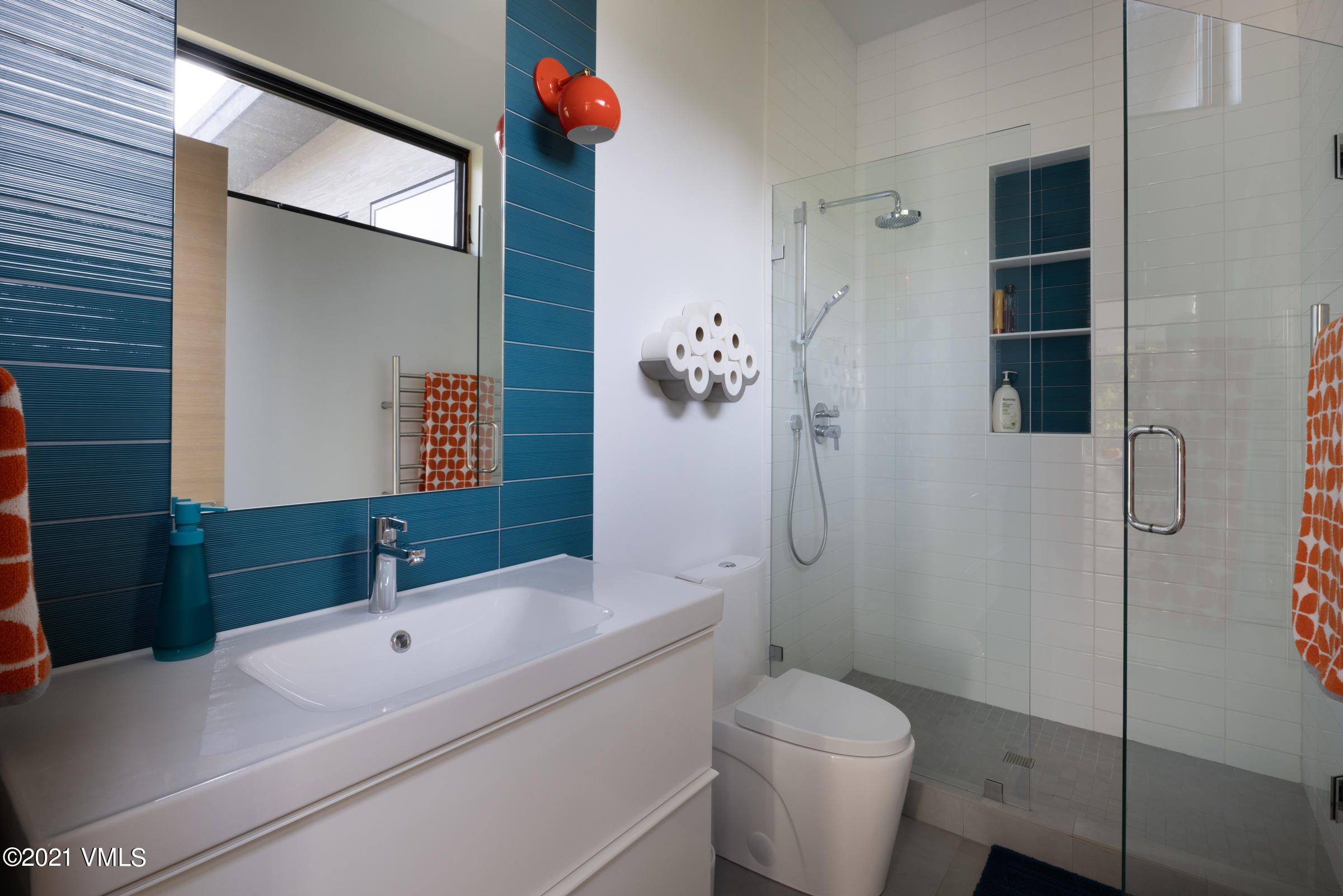 4380 June Point Avon, CO 81620 - Photo 23 of 39 a bathroom with a sink a toilet and shower