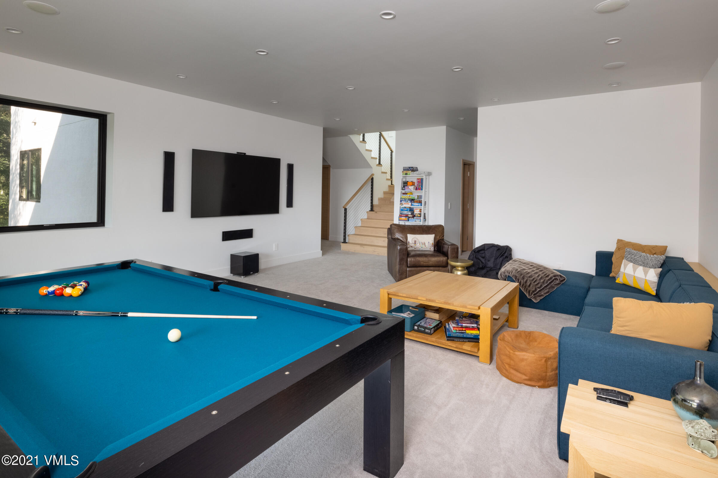 4380 June Point Avon, CO 81620 - Photo 27 of 39 a living room with furniture and a flat screen tv
