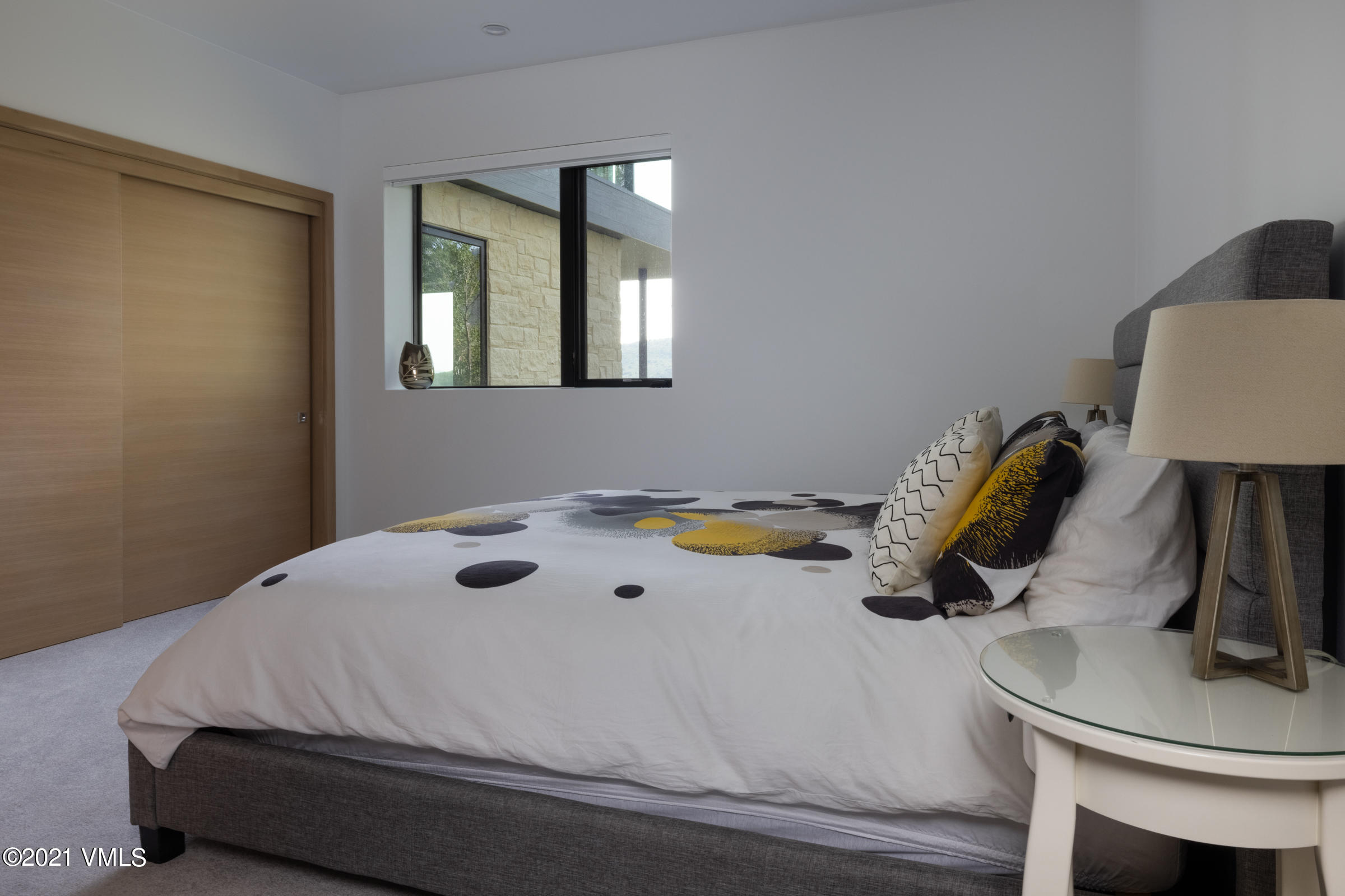 4380 June Point Avon, CO 81620 - Photo 28 of 39 a bedroom with a bed and a dresser