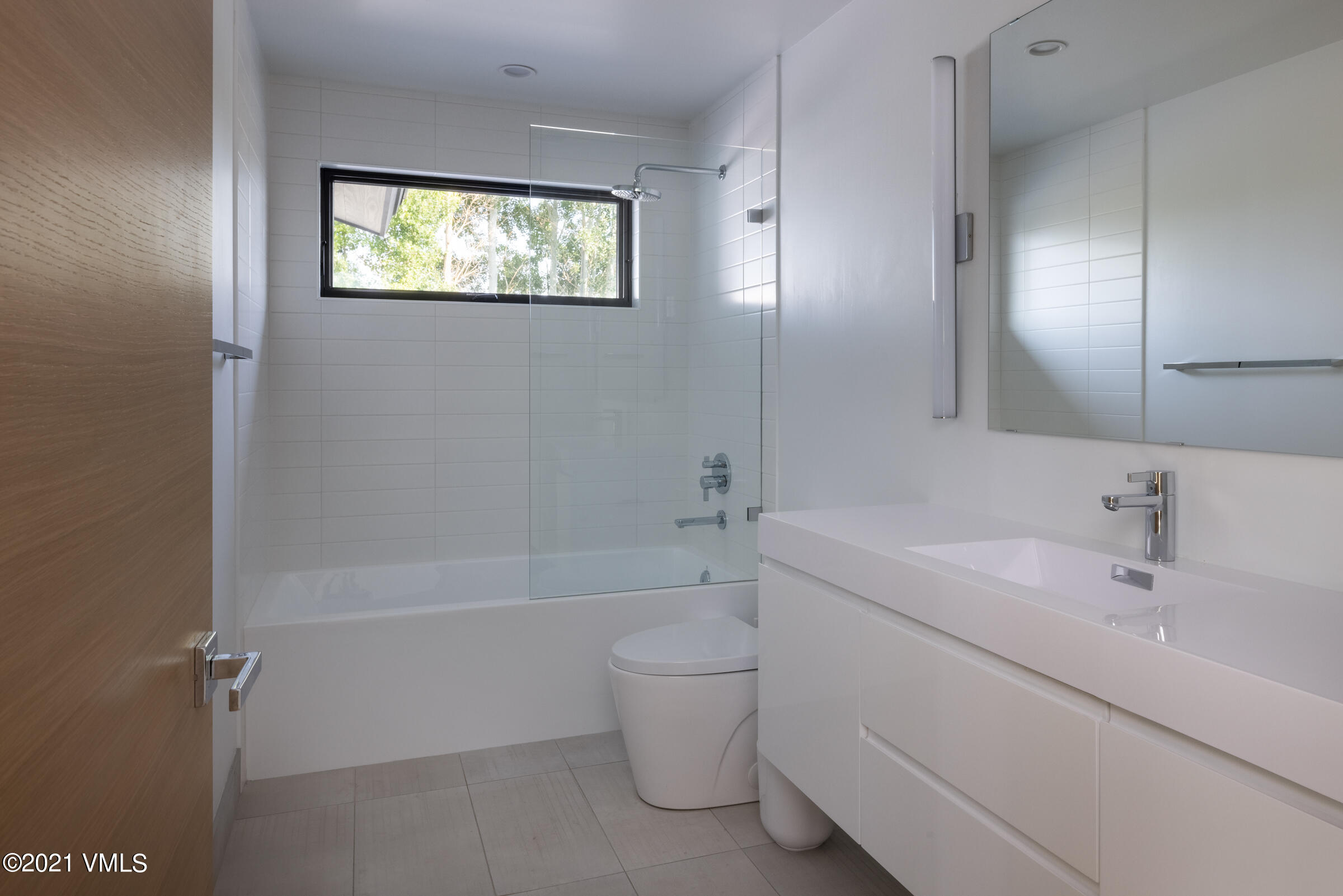 4380 June Point Avon, CO 81620 - Photo 29 of 39 a bathroom with a sink a toilet and shower