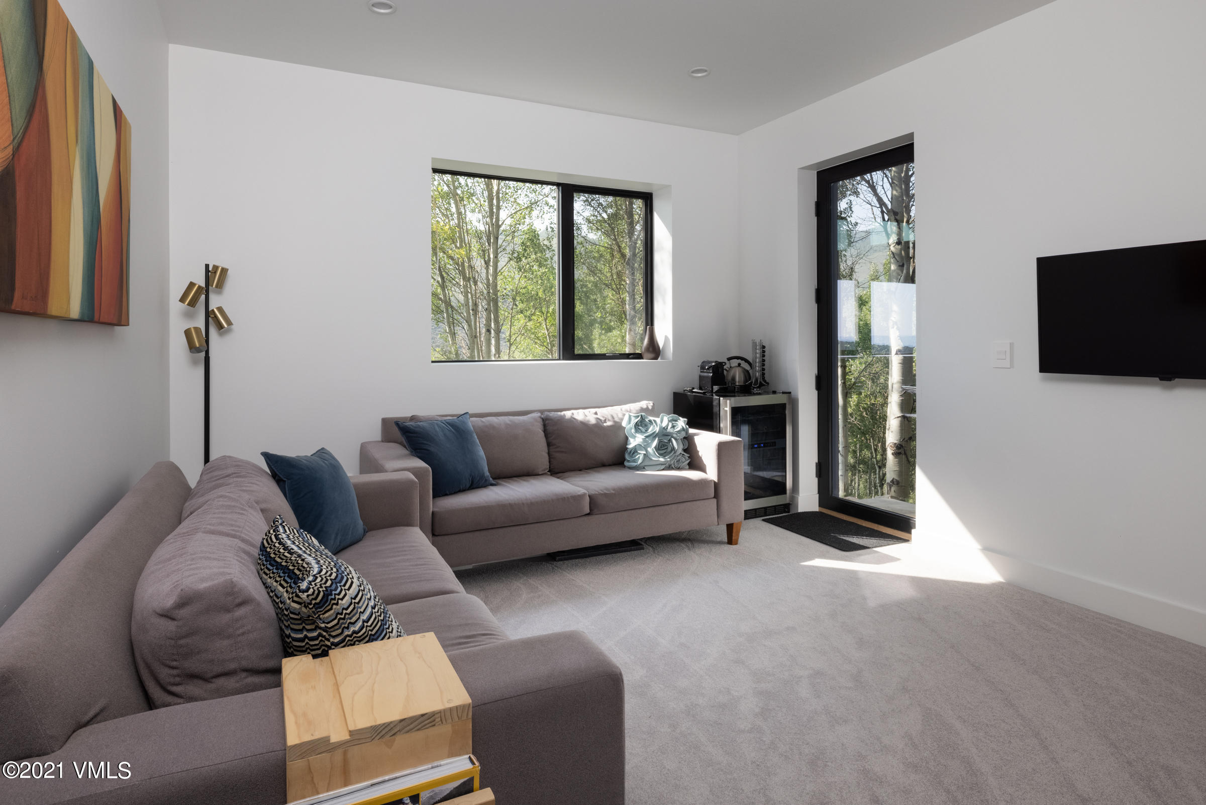 4380 June Point Avon, CO 81620 - Photo 31 of 39 a living room with furniture and a flat screen tv
