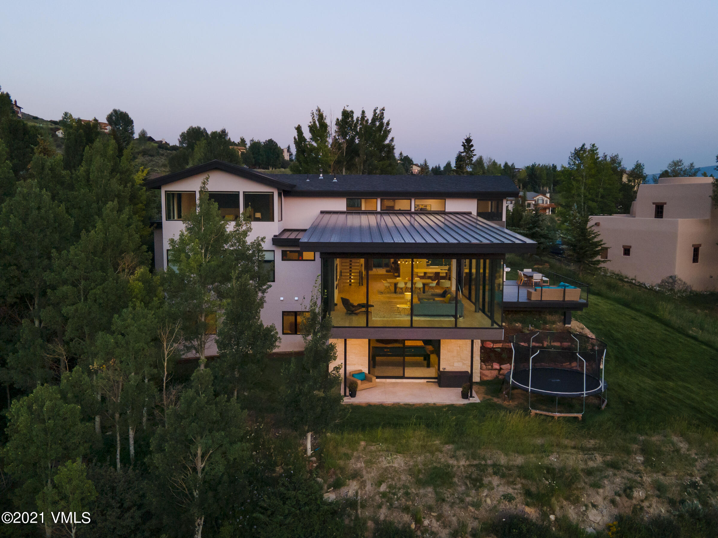 4380 June Point Avon, CO 81620 - Photo 34 of 39 a front view of a house with garden