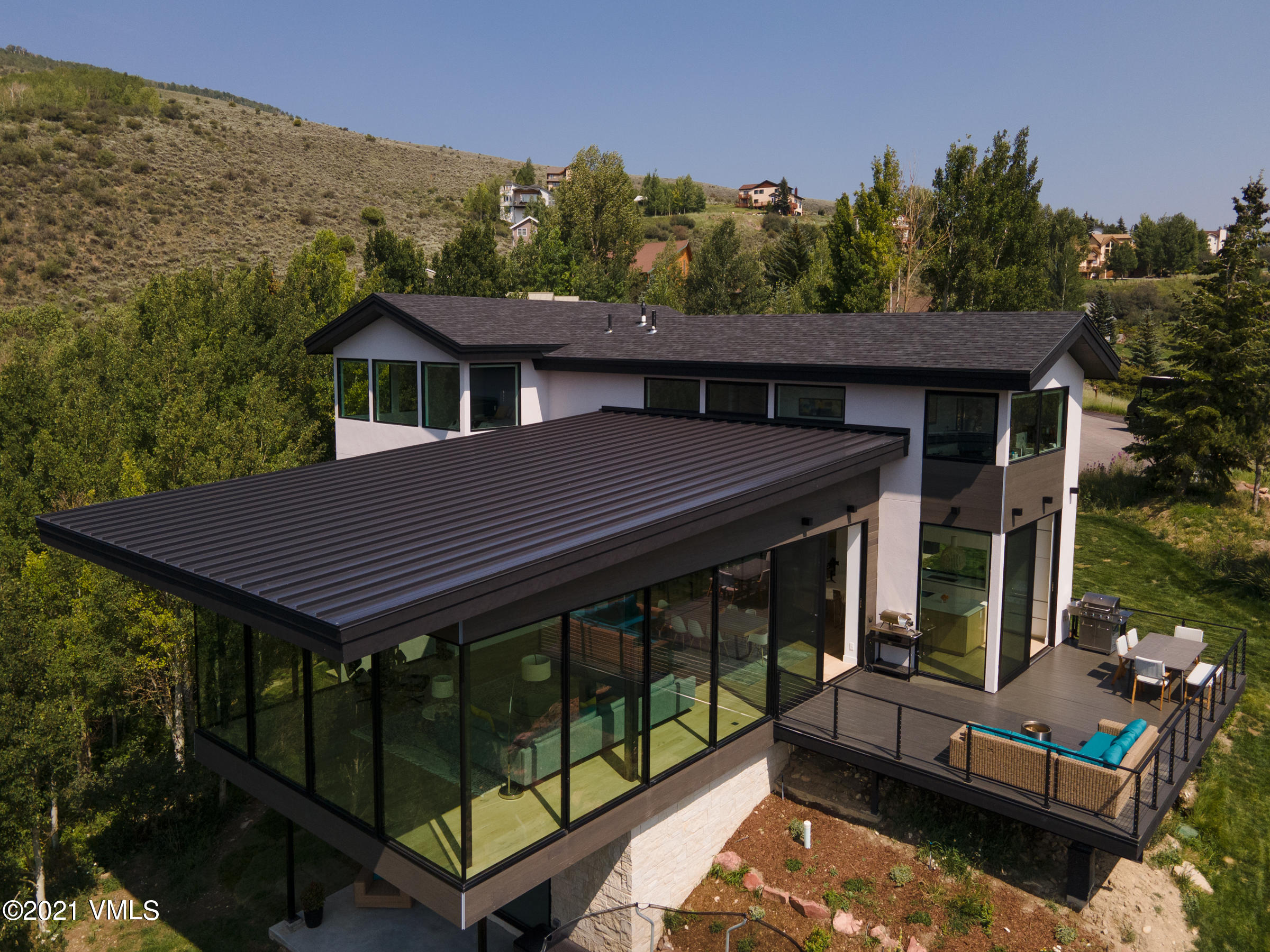 4380 June Point Avon, CO 81620 - Photo 35 of 39 a view of a house with a balcony wooden floor and a potted plant