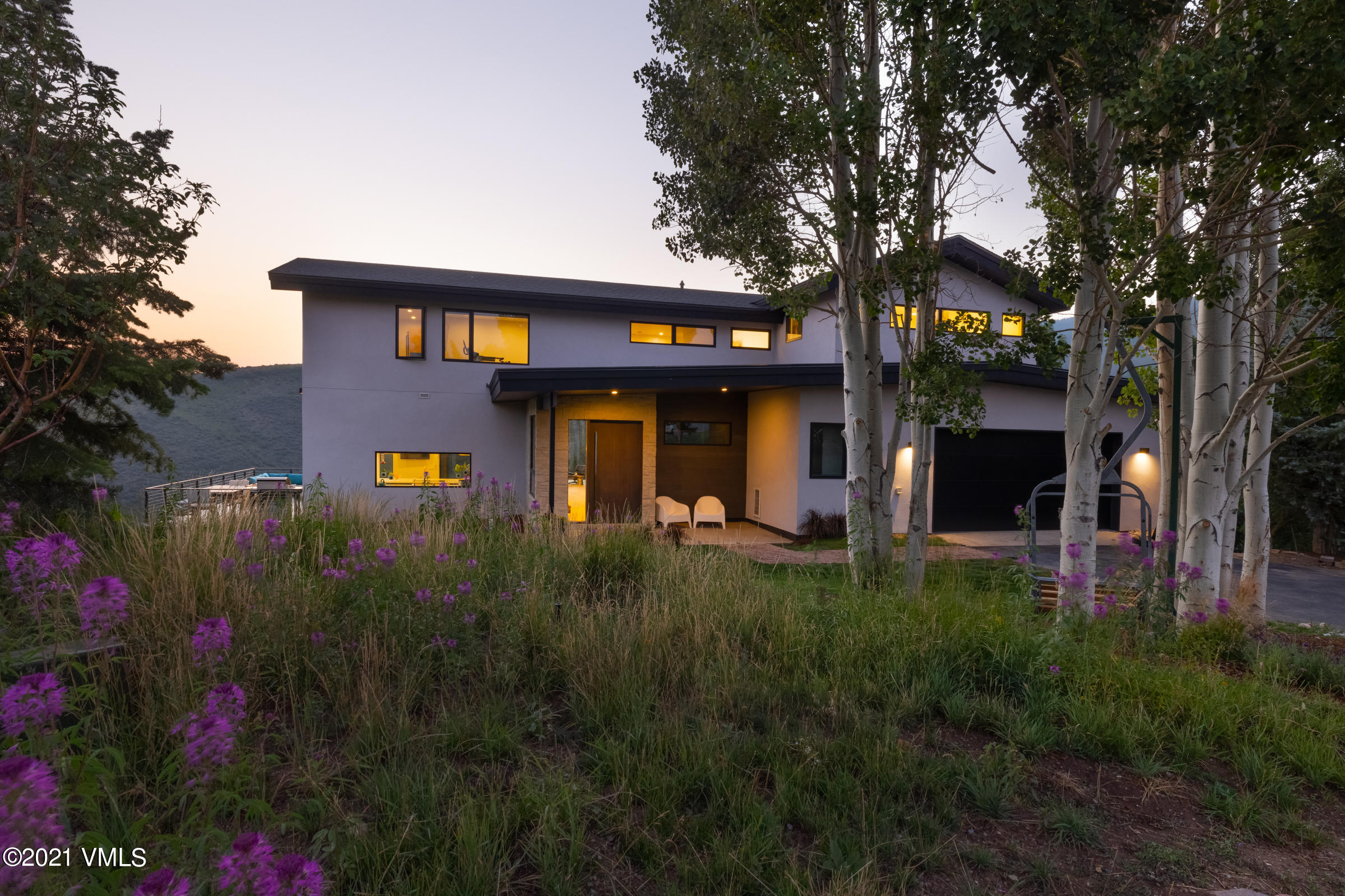 4380 June Point Avon, CO 81620 - Photo 38 of 39 a front view of a house with a yard