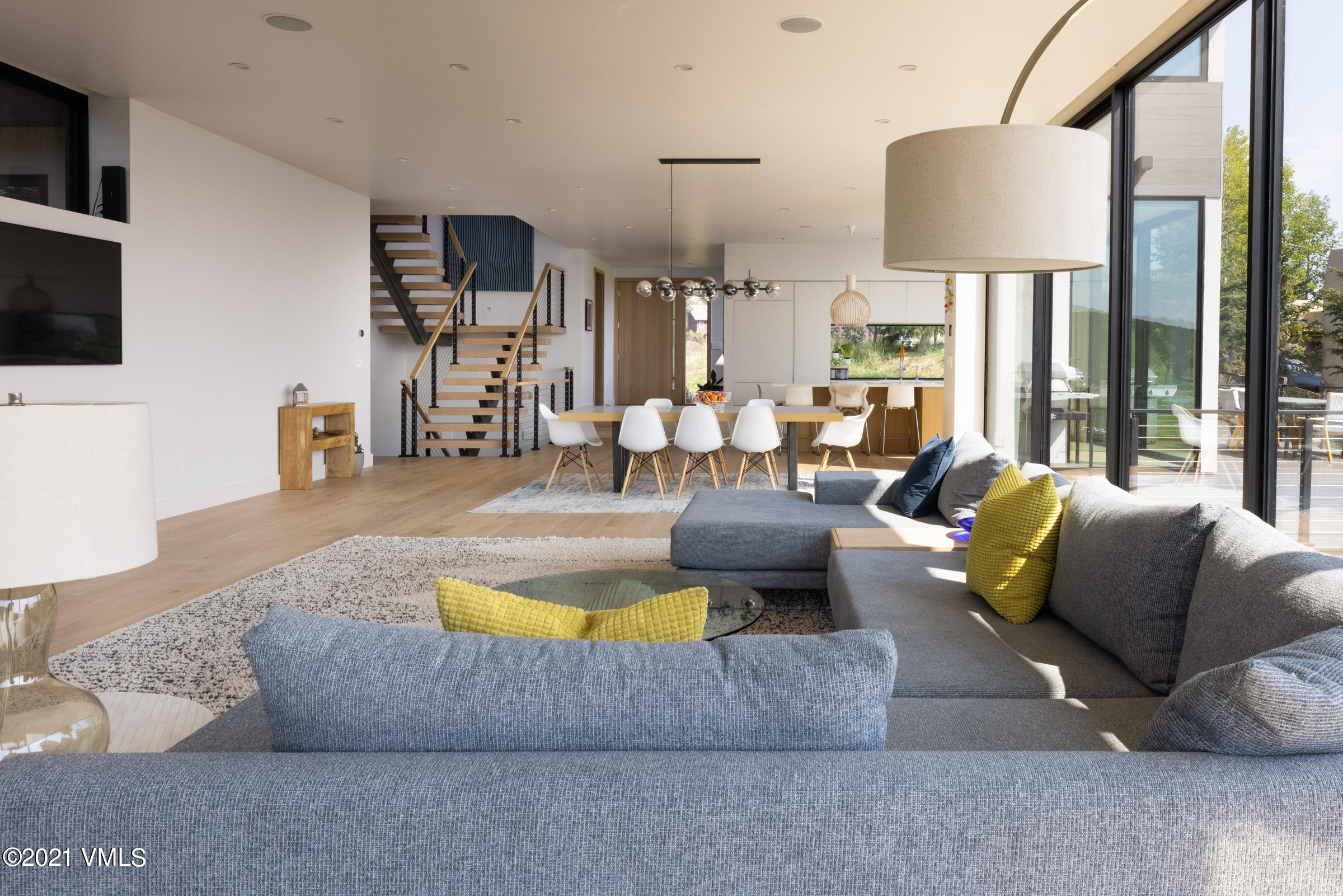 4380 June Point Avon, CO 81620 - Photo 9 of 39 a living room with furniture and a flat screen tv