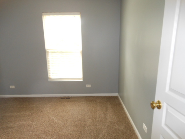603 Conservatory Lane Aurora, IL 60502 - Photo 15 of 18 an empty room with a window