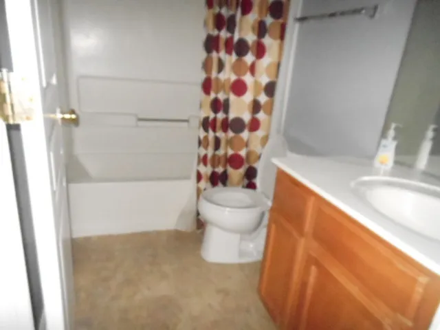 a bathroom with a bathtub and toilet