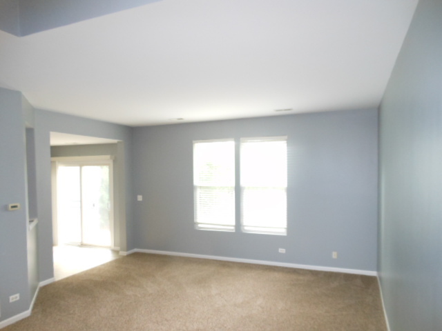 603 Conservatory Lane Aurora, IL 60502 - Photo 2 of 18 an empty room with a window