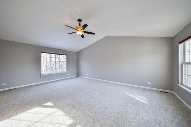 a view of room with a ceiling fan and window
