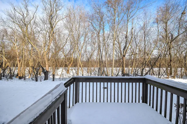 a view of a house with wooden fence