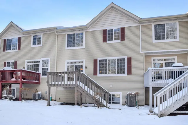 a view of a deck yard with a table and chairs