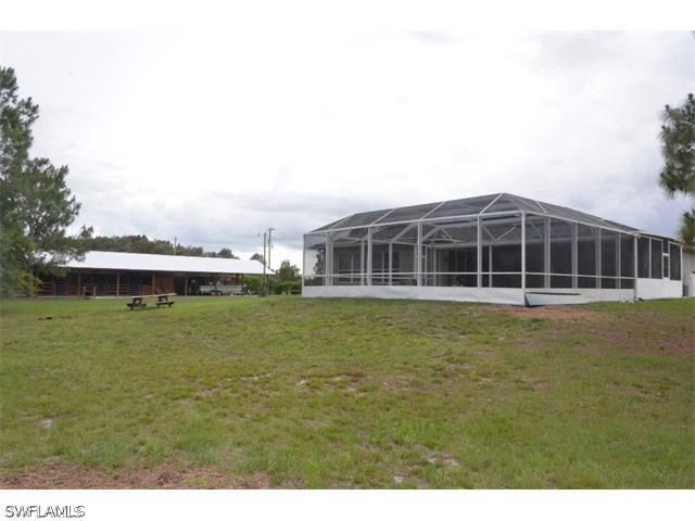 11791 Shawnee Road Fort Myers, FL 33913 - Photo 3 of 17 a view of a large building with a big yard
