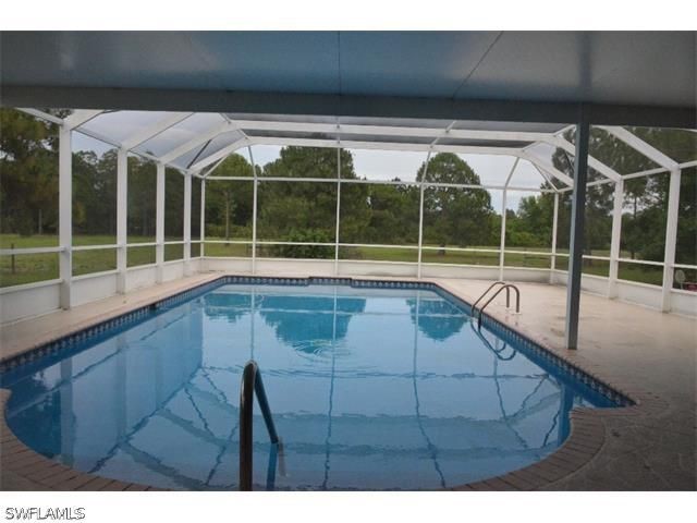 11791 Shawnee Road Fort Myers, FL 33913 - Photo 5 of 17 a view of a living room and balcony