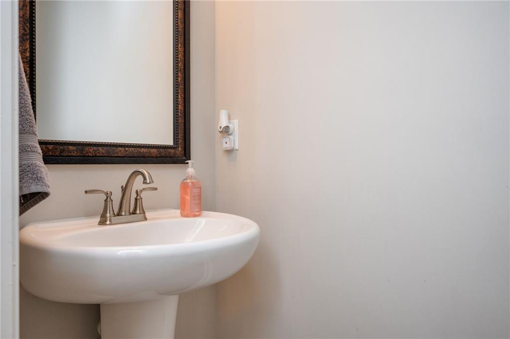 4575 Birch Way Loganville, GA 30052 - Photo 17 of 40 a bathroom with a sink and a mirror