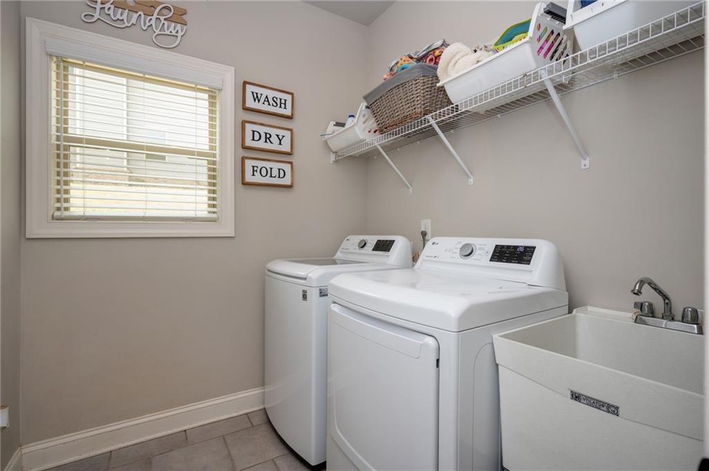 4575 Birch Way Loganville, GA 30052 - Photo 18 of 40 a utility room with dryer and washer