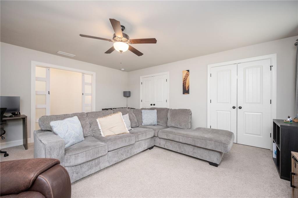 4575 Birch Way Loganville, GA 30052 - Photo 30 of 40 a living room with furniture and a couch