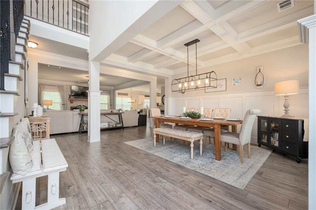 4575 Birch Way Loganville, GA 30052 - Photo 3 of 40 a view of a dining room with furniture and wooden floor