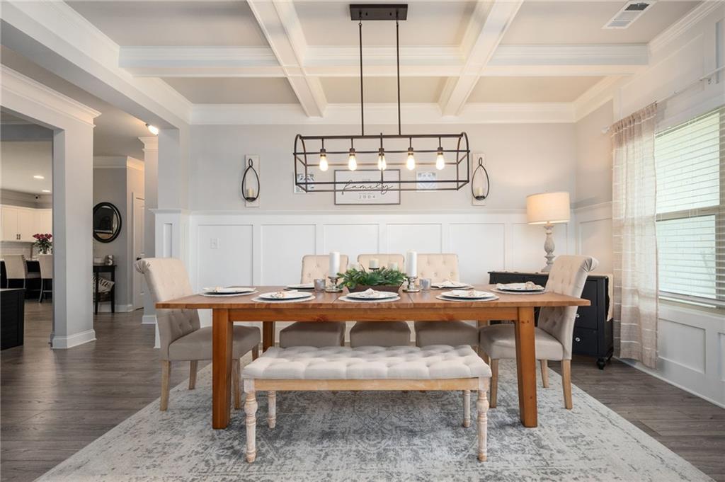 4575 Birch Way Loganville, GA 30052 - Photo 5 of 40 a view of a dining room with furniture window and wooden floor