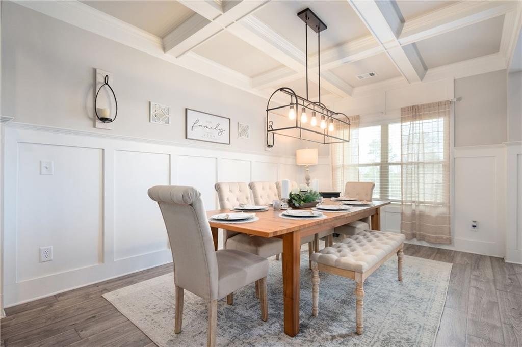 4575 Birch Way Loganville, GA 30052 - Photo 6 of 40 a view of a dining room with furniture window and wooden floor