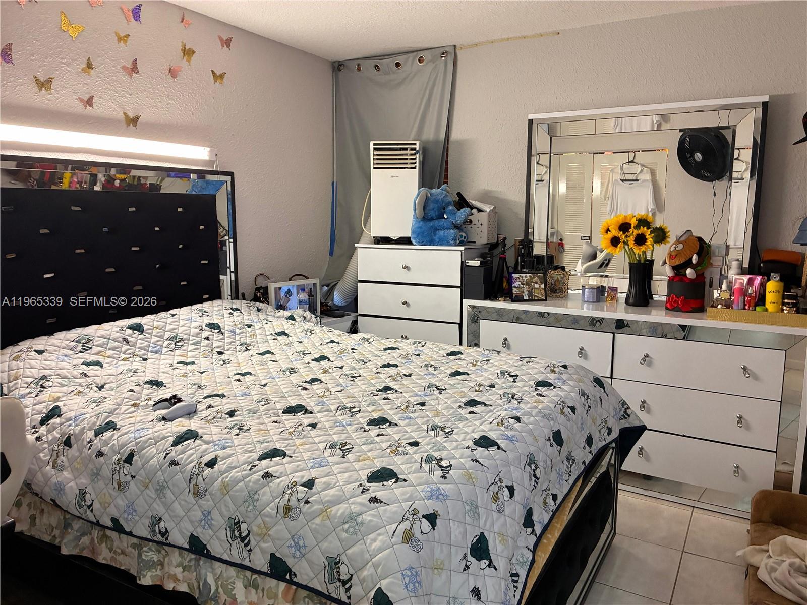 1900 West 68th Street, Unit G103 Hialeah, FL 33014 - Photo 11 of 20 a bedroom with a bed and a dresser