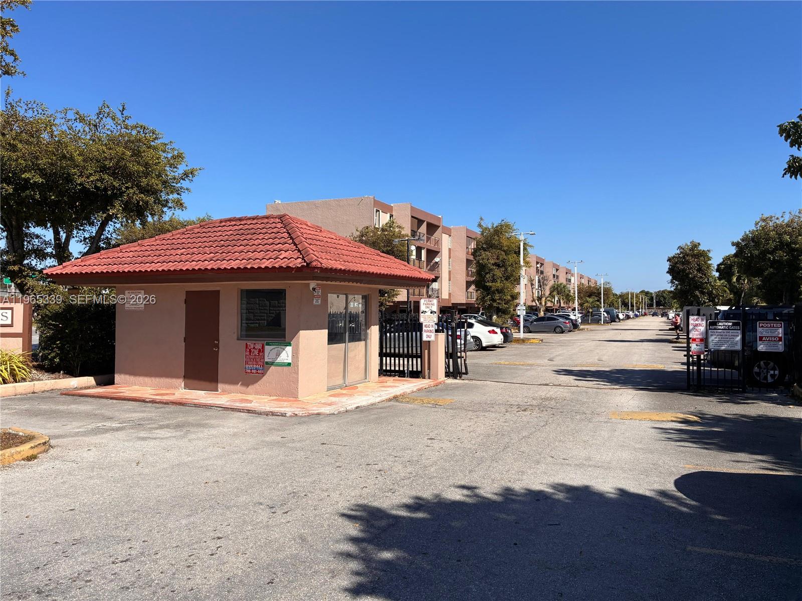 1900 West 68th Street, Unit G103 Hialeah, FL 33014 - Photo 4 of 20 a view of a street with houses