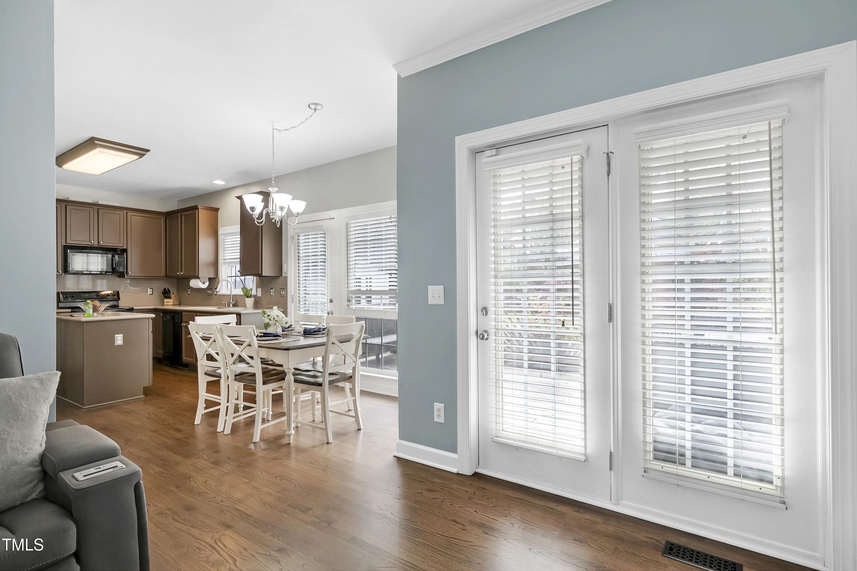 102 Kenneil Court Apex, NC 27502 - Photo 11 of 55 a view of a dining room with furniture and wooden floor
