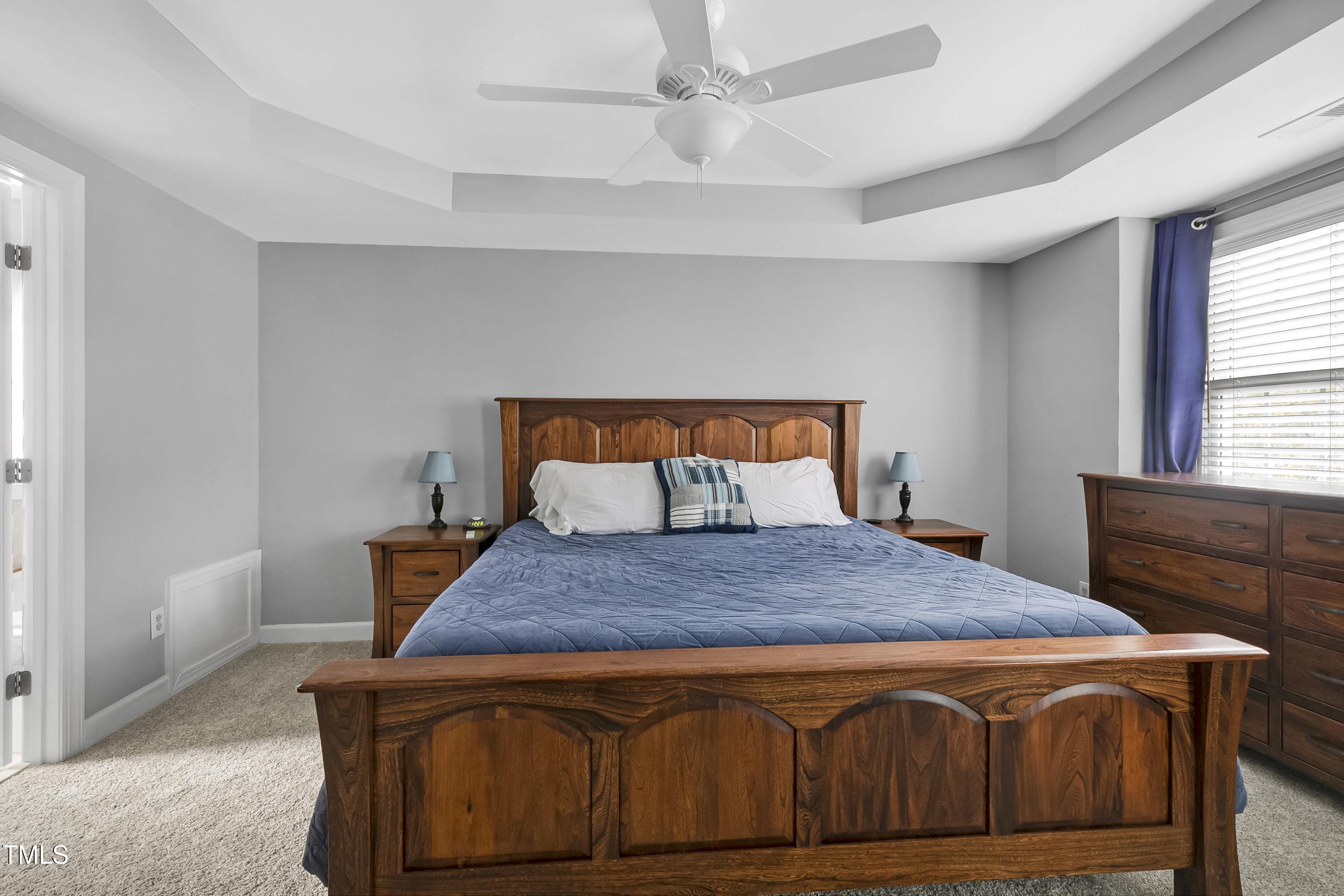 102 Kenneil Court Apex, NC 27502 - Photo 19 of 55 a bedroom with a bed and a window