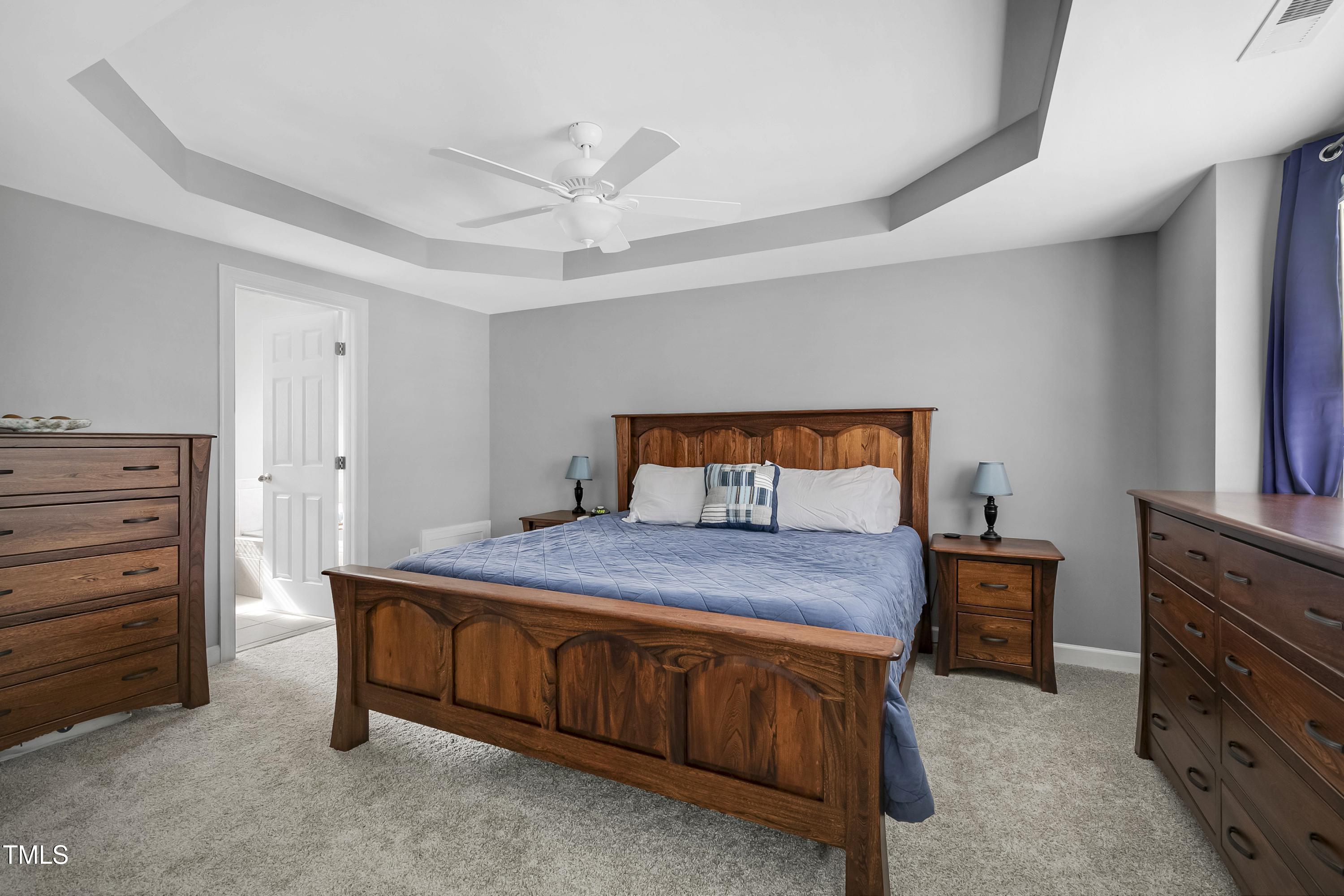102 Kenneil Court Apex, NC 27502 - Photo 20 of 55 a bedroom with a bed and a dresser