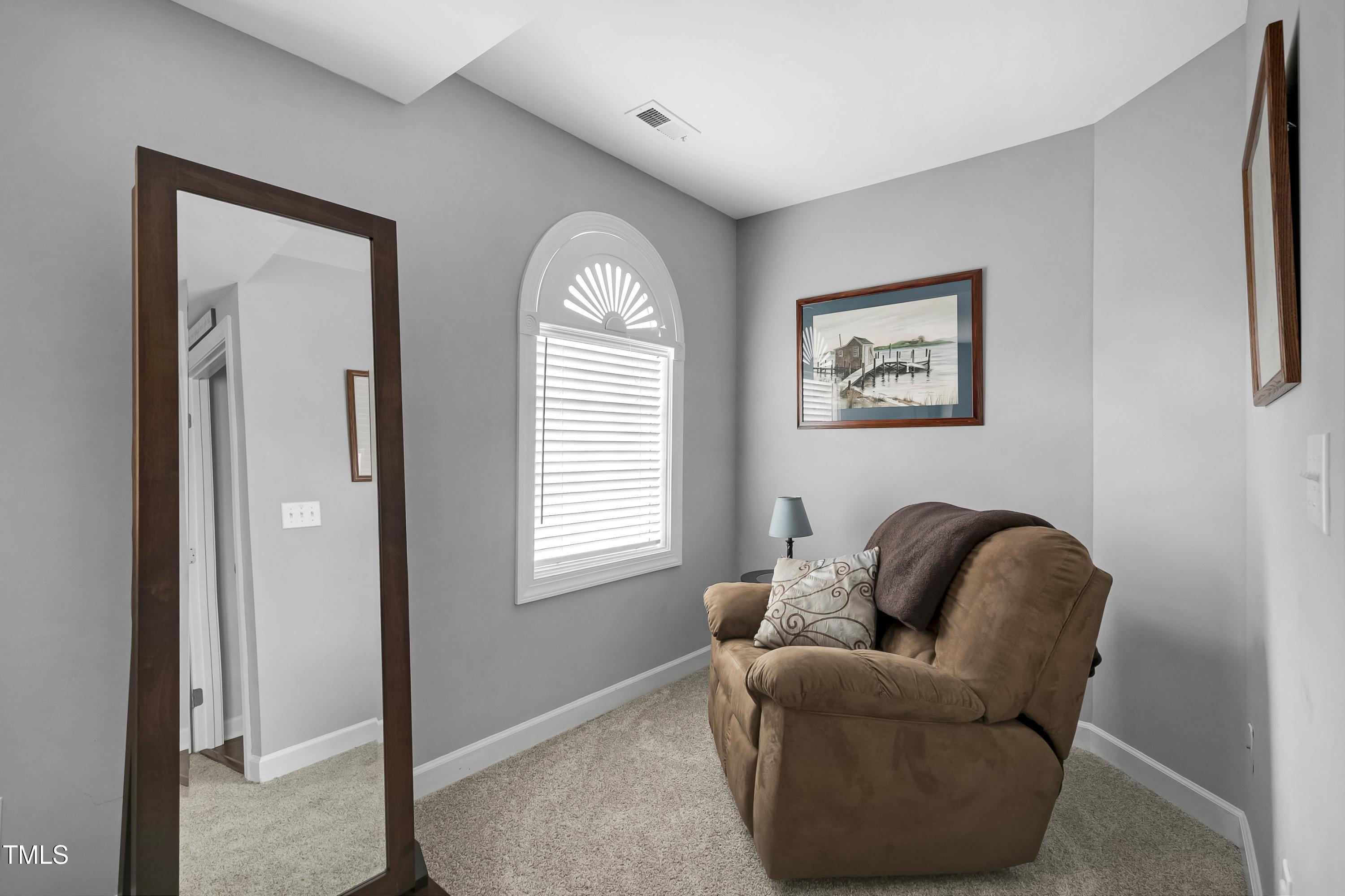 102 Kenneil Court Apex, NC 27502 - Photo 22 of 55 a living room with furniture and a window